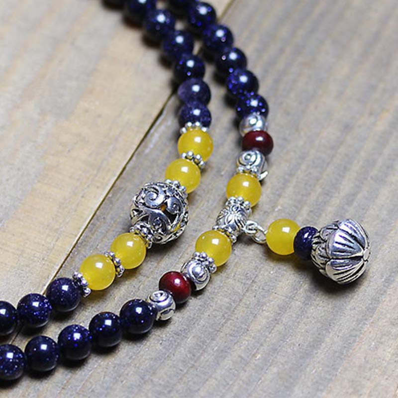 Braccialetto Mala con ciondolo di ricchezza in arenaria blu Buddha Stones - Image 6