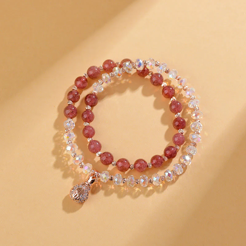 Braccialetto positivo con ciondolo a forma di borsa per soldi in cristallo bianco e quarzo fragola Buddha Stones - Image 2