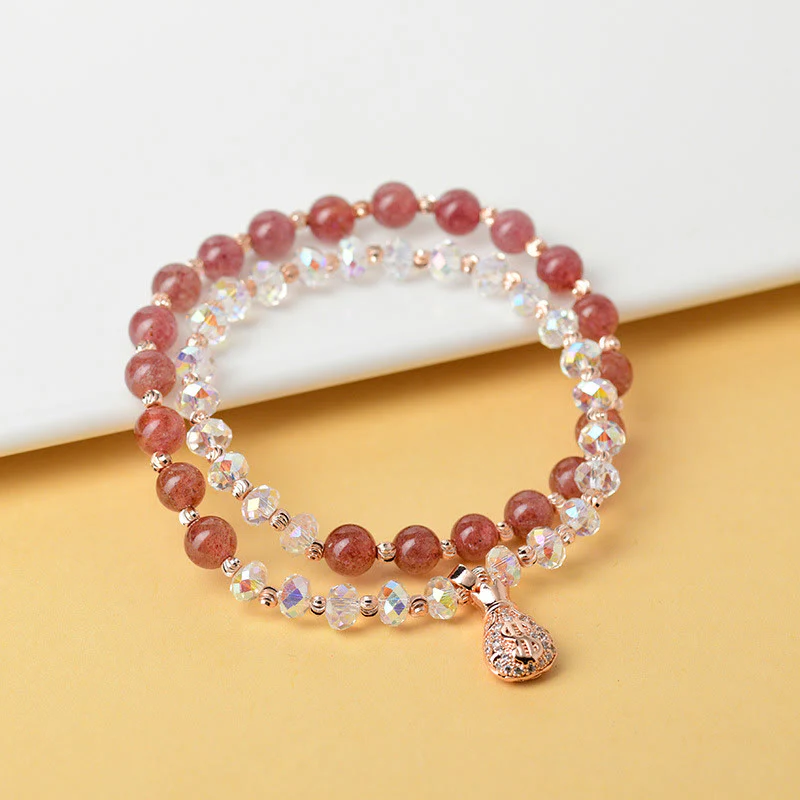 Braccialetto positivo con ciondolo a forma di borsa per soldi in cristallo bianco e quarzo fragola Buddha Stones - Image 3