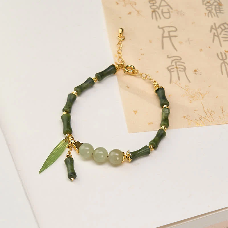 Buddha Stones Bracciale della pace con peridoto e perline di giada Hetian e mosca tampone di bambù.