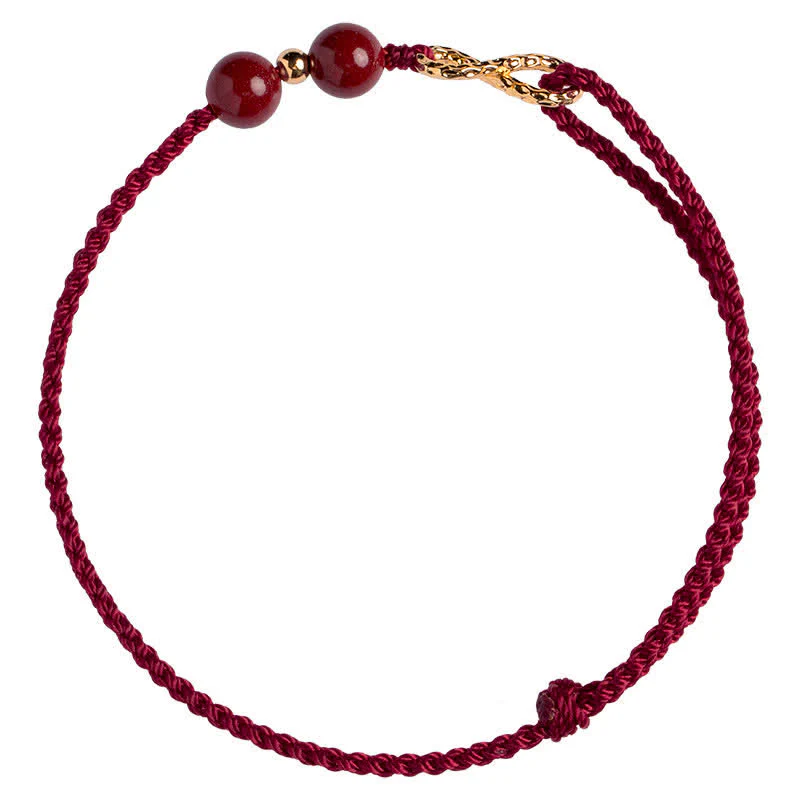 Braccialetto alla cavigliera con simbolo dell'infinito dorato e cordino rosso con Buddha Stones e cinabro. - Image 9