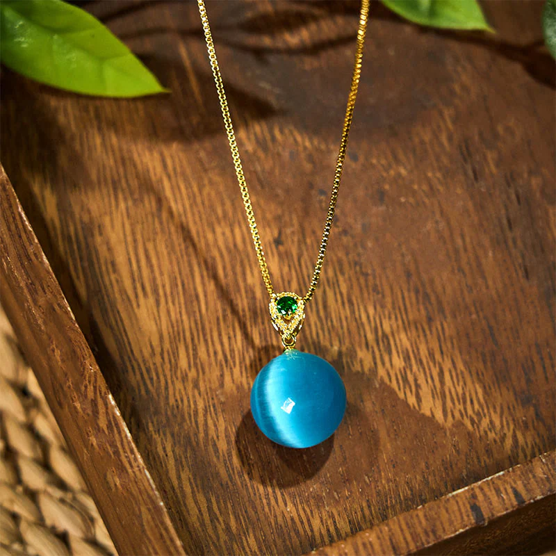 Buddha Stones Collana con ciondolo a forma di palla rotonda con occhio di gatto e simbolo di fiducia - Image 2