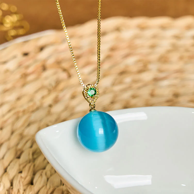 Buddha Stones Collana con ciondolo a forma di palla rotonda con occhio di gatto e simbolo di fiducia - Image 3