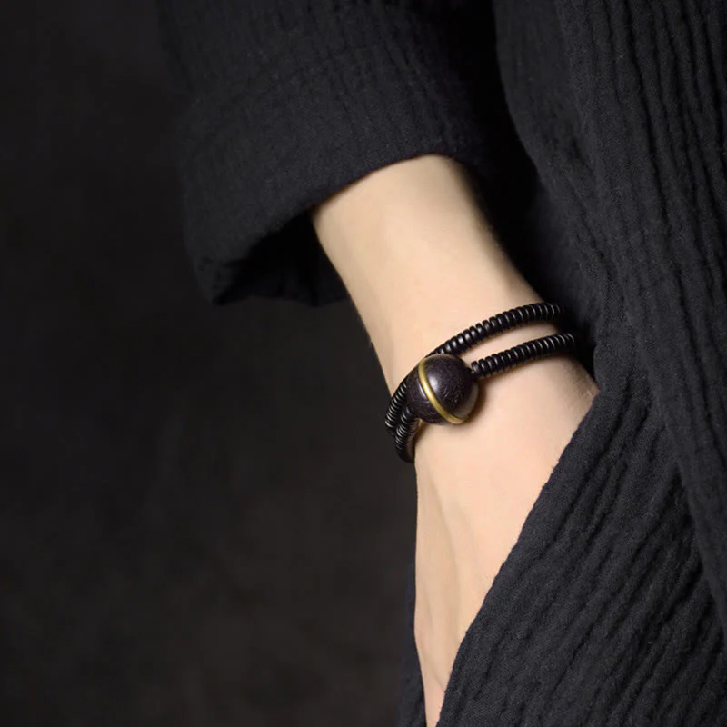 Collana con bracciale a doppio giro in Buddha Stones, in legno di ebano, in ottone e rame, con sfera di equilibrio cubica - Image 10