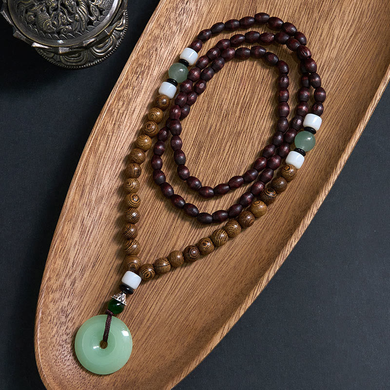 Collana con ciondolo Buddha Stones Wenge Wood Peace Buckle Balance Tranquility