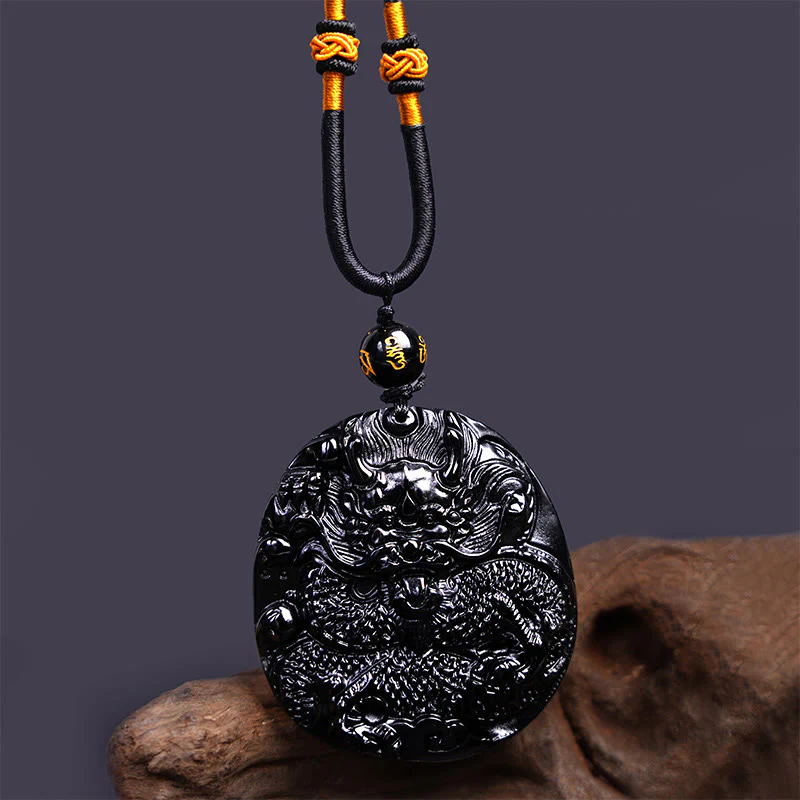 Collana con ciondolo di protezione in ossidiana nera naturale con drago intagliato rotondo in Buddha Stones - Image 5