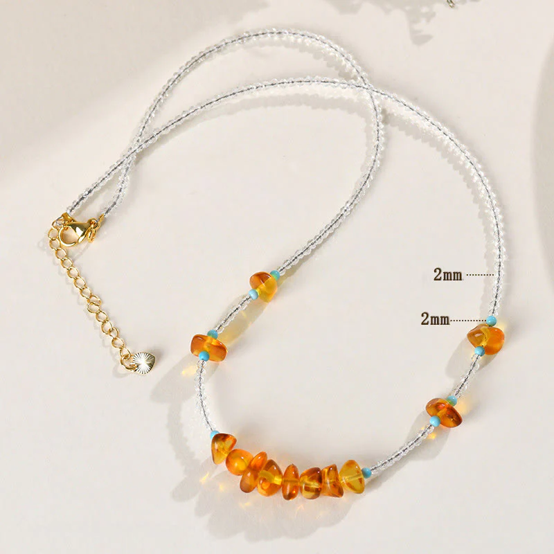 Collana con ciondolo in ambra di purezza irregolare con perline di cristallo bianco Buddha Stones - Image 8