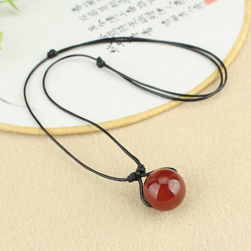 Collana con ciondolo in corda di pelle con perline di agata rossa e Buddha Stones - Image 4
