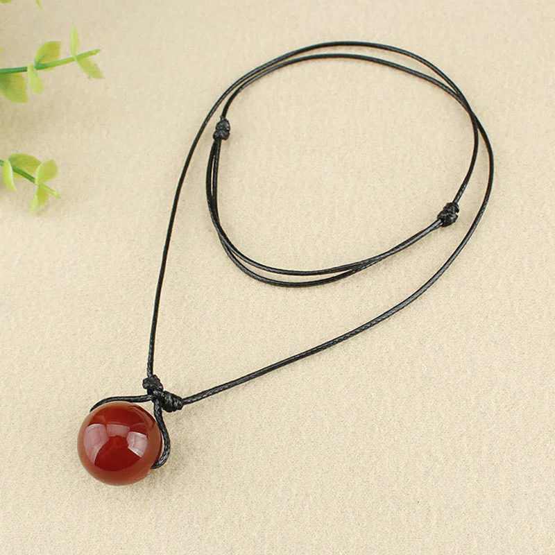 Collana con ciondolo in corda di pelle con perline di agata rossa e Buddha Stones - Image 7