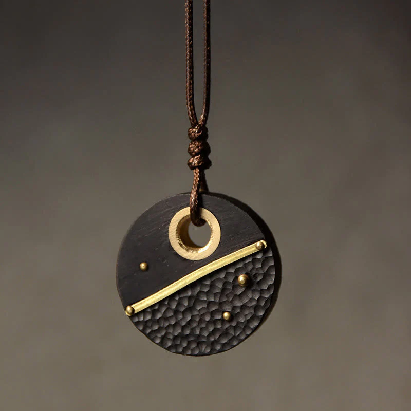 Collana con ciondolo in ottone e rame con Buddha Stones, realizzata a mano, in legno di ebano e pietra della pace