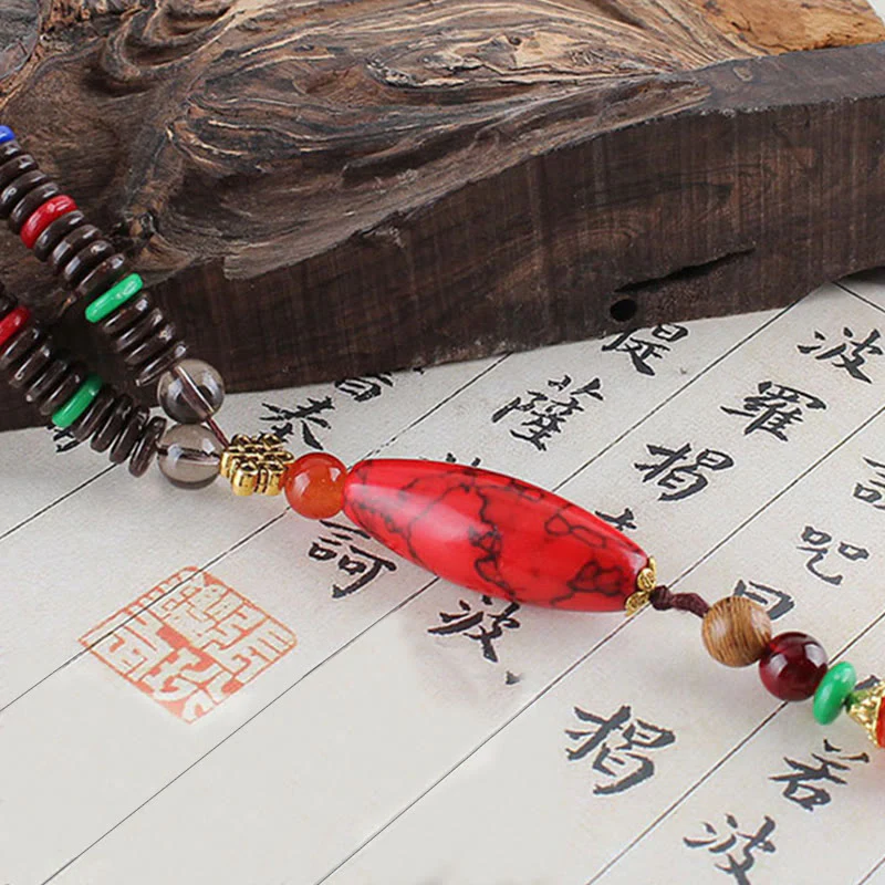 Collana con ciondolo in pietra turchese, pietra di legno di wenge, protezione e calma Buddha Stones - Image 9