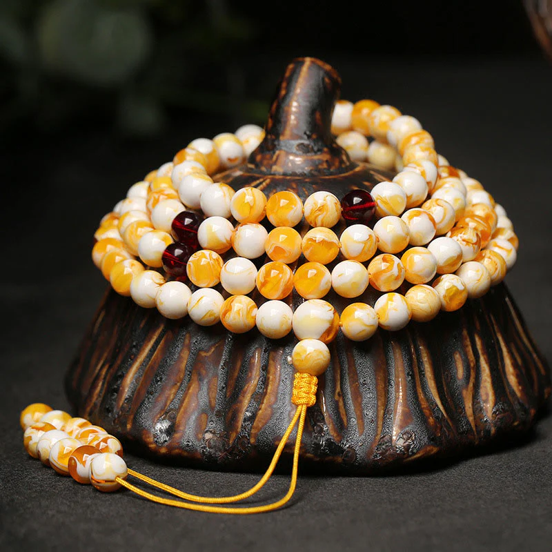Mala tibetano in ambra bianca e gialla con 108 perle Buddha Stones